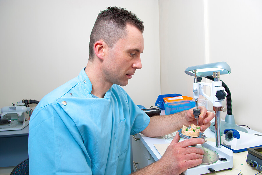 Mirza Sljivo working in Ashford Denture Clinic's lab